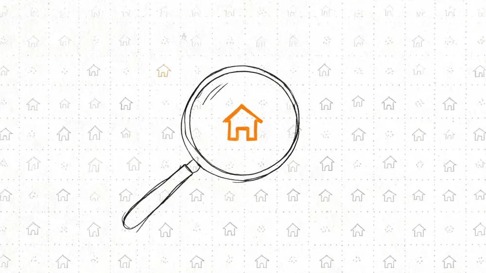 Una lupa enfocando el icono naranja de una casa sobre un fondo con patrones de casas